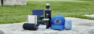 Golf tournament player gift package featuring promotional items and golf accessories.